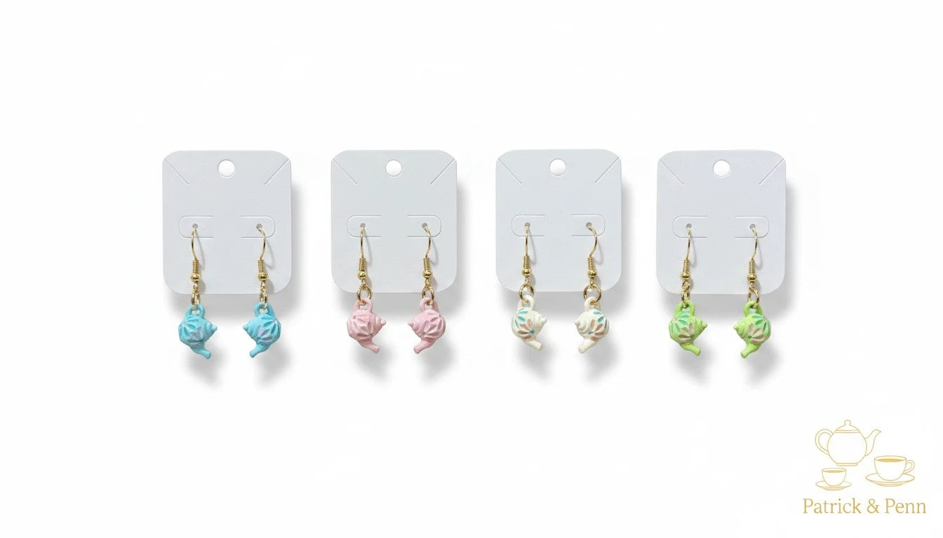 Patrick and Penn miniature teapot dangle earrings in pastel blue, pink, white, and green with gold-tone hooks.