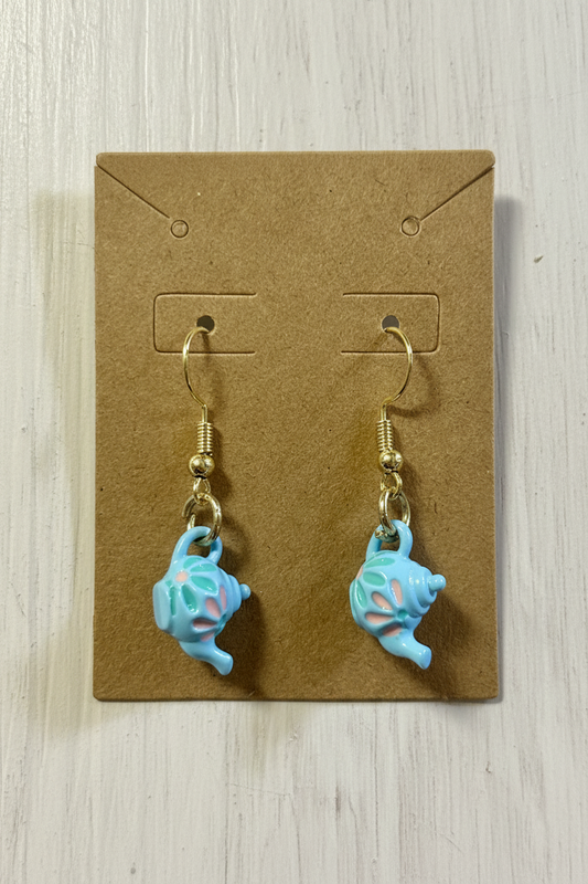 Teal floral teapot shaped earrings on a brown card